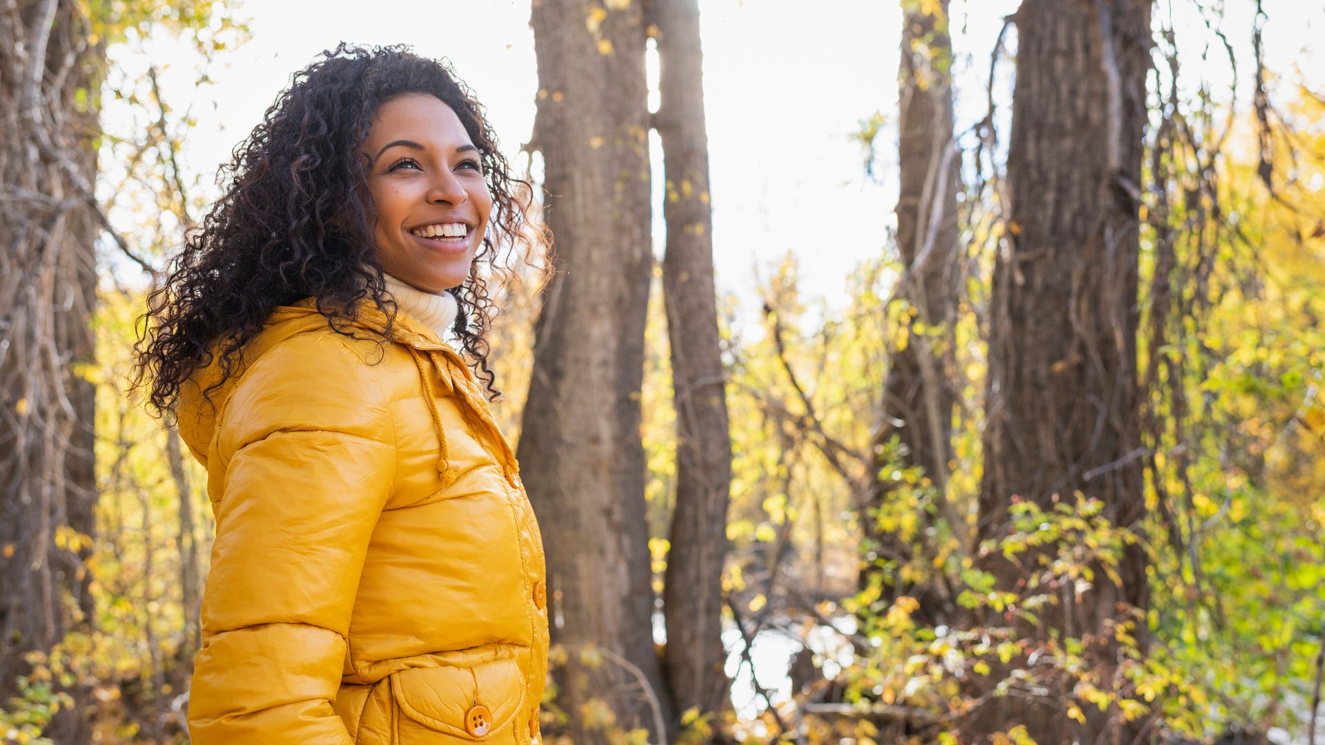 Young woman in autumn woods
