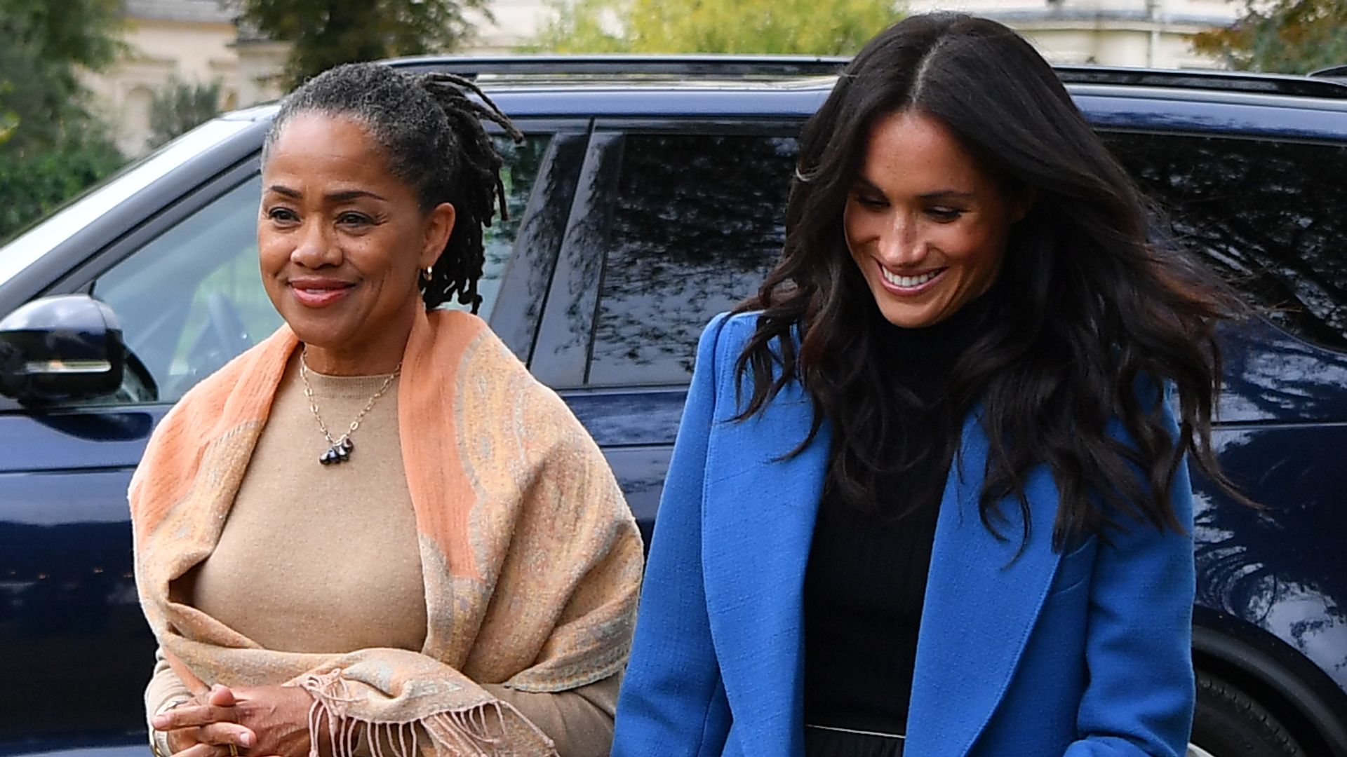 Doria Ragland and Meghan Markle walking through Kensington Palace gardens