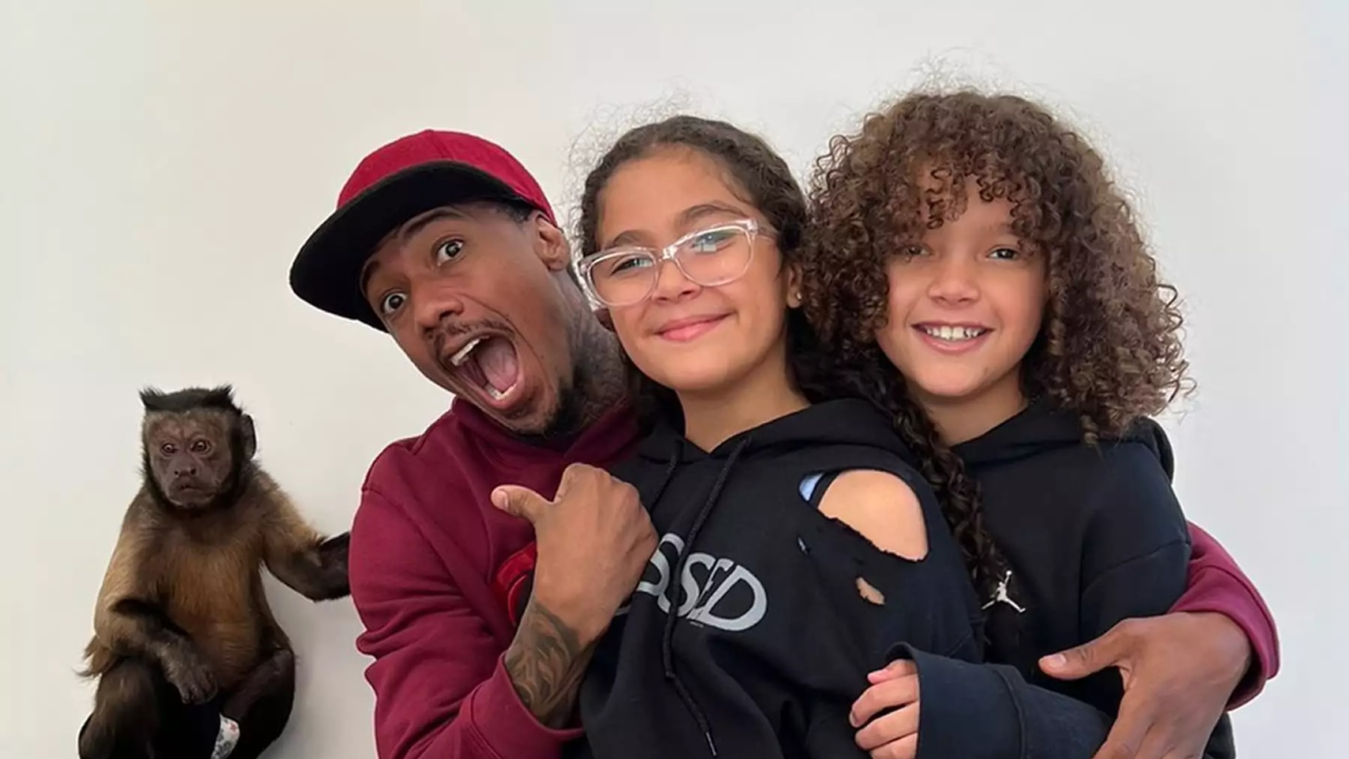 nick cannon hugging moroccan and monroe