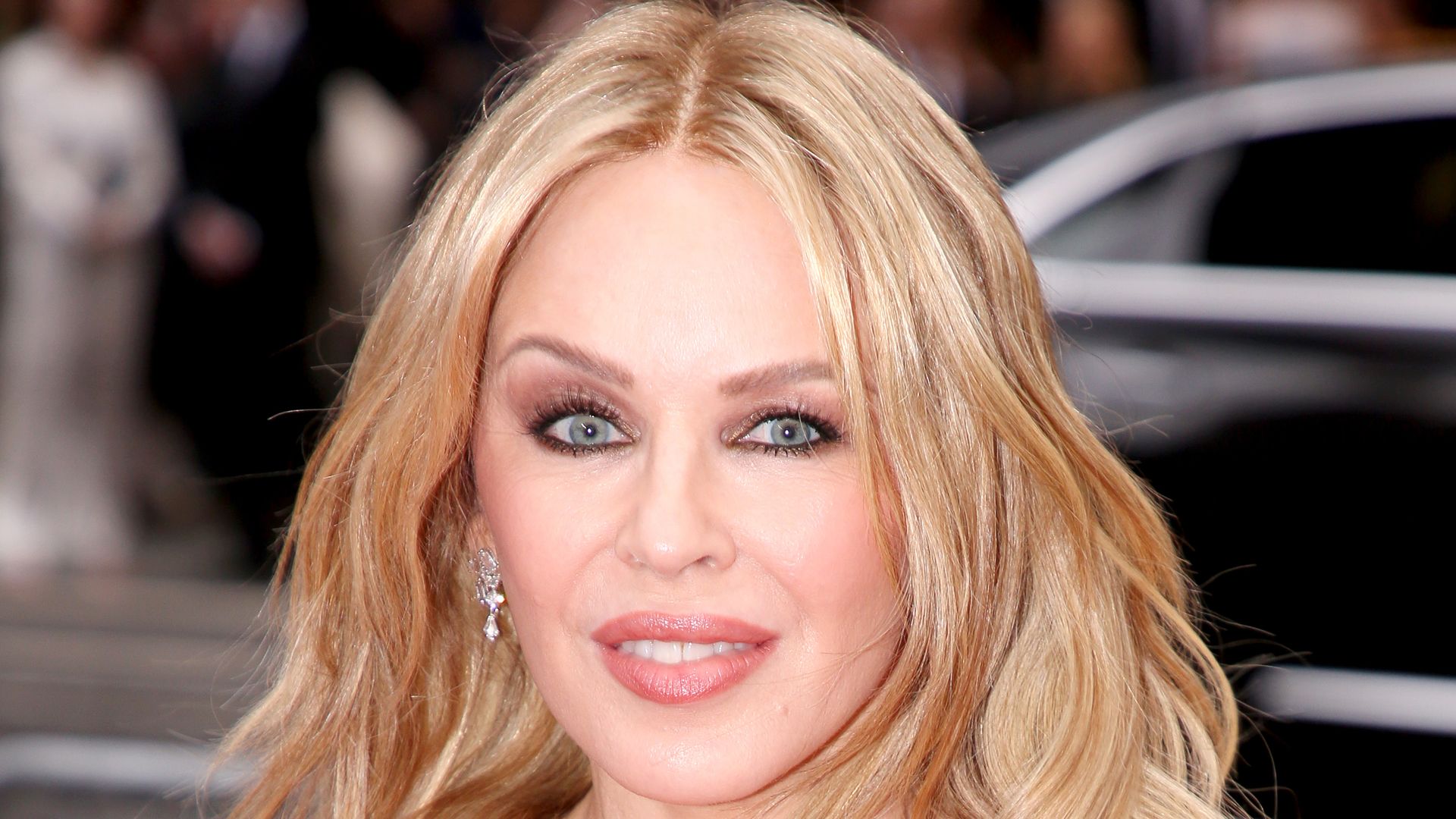 Kylie Minogue is ageless as she poses up a storm in waist-cinching jeans