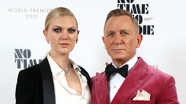 Daniel Craig and Ella Loudon, wearing Brunello Cuccinelli and Faberge at the World Premiere of "NO TIME TO DIE" at the Royal Albert Hall on September 28, 2021 in London, England