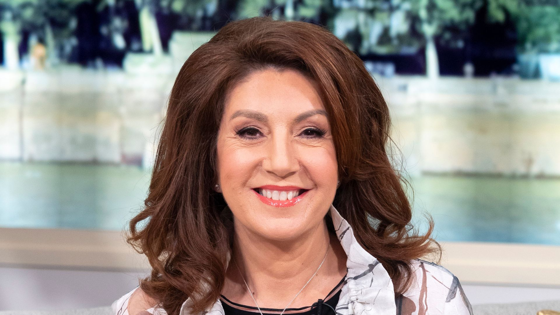 Jane McDonald in nature-themed shirt and black top
