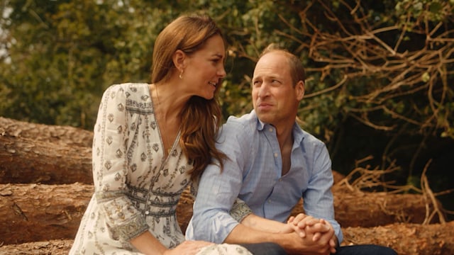 Kate Middleton and Prince William look of love while sitting on log stack