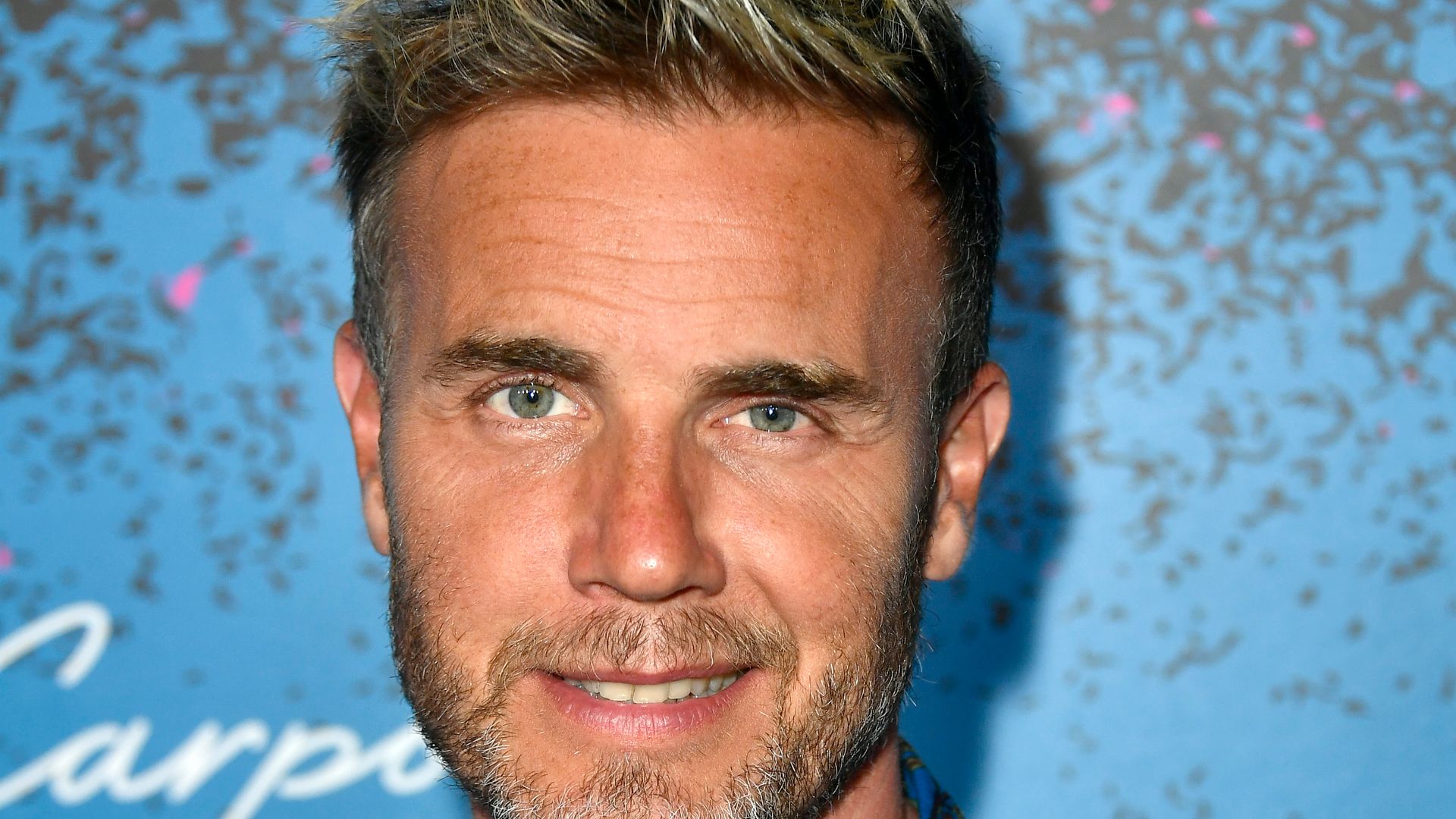 Gary Barlow in a blue floral shirt