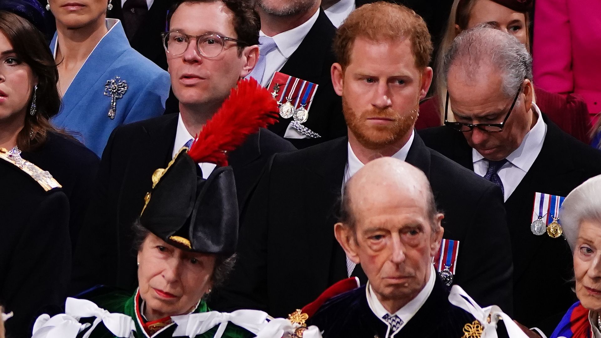 Princess Anne seated in front of Prince Harry at coronation