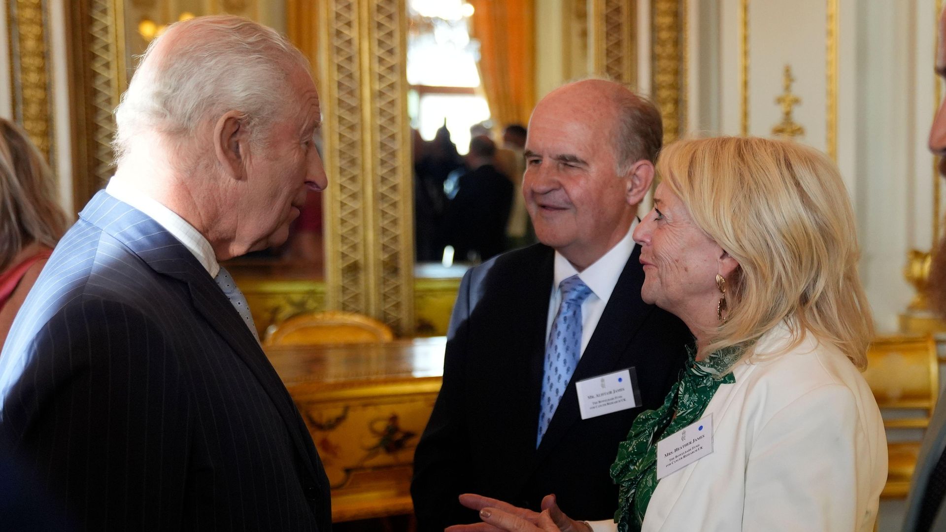 King Charles speaking with the parents of Deborah James, Alistair and Heather