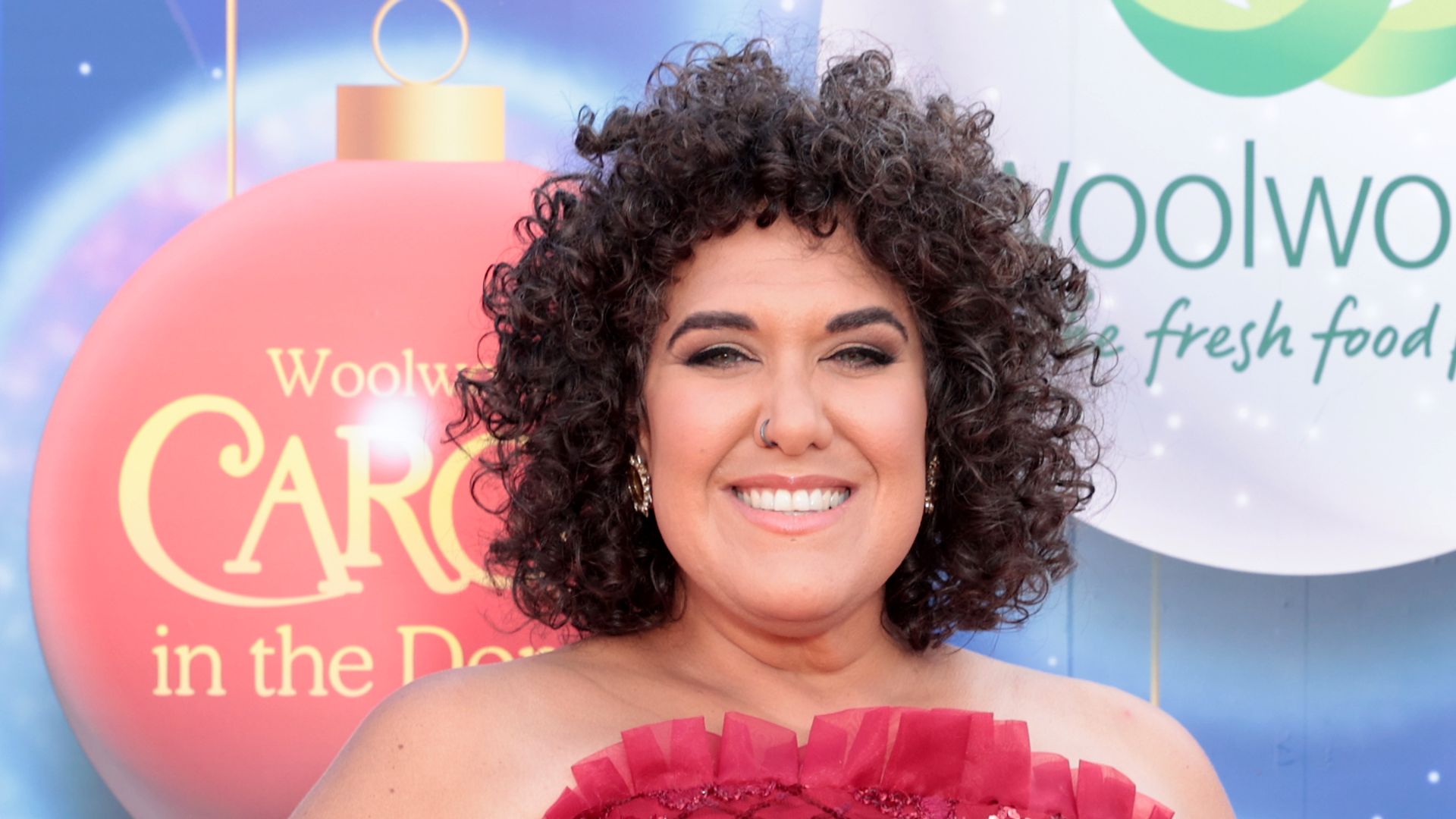 Casey Donovan in red dress