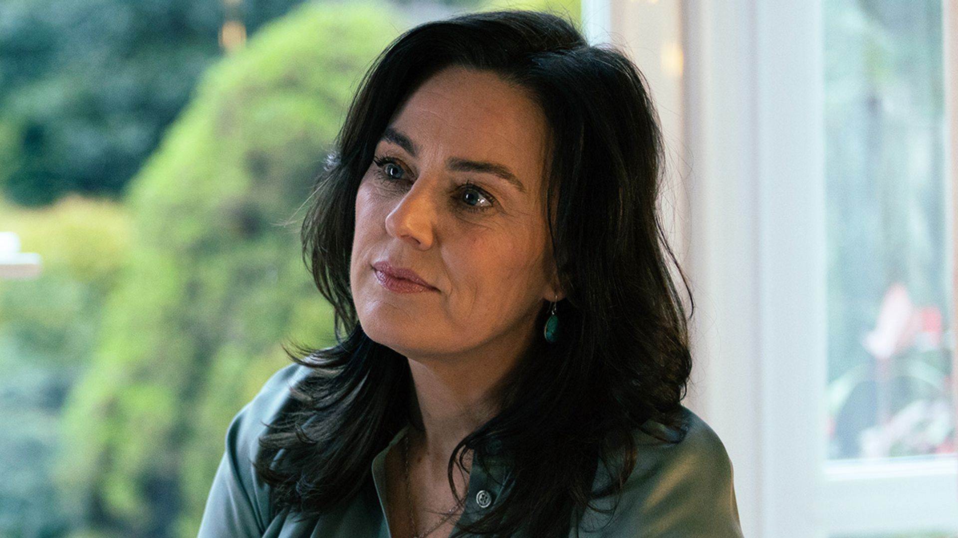 close-up of brunette woman in house