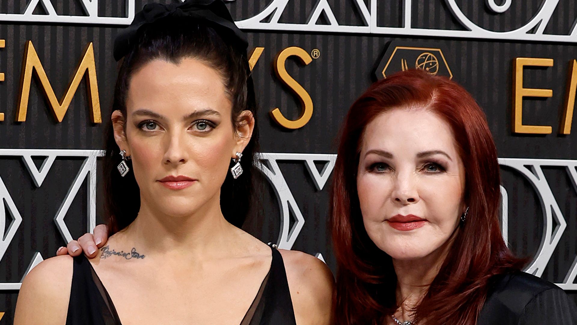 photo of riley keough and priscilla presley wearing black outfits
