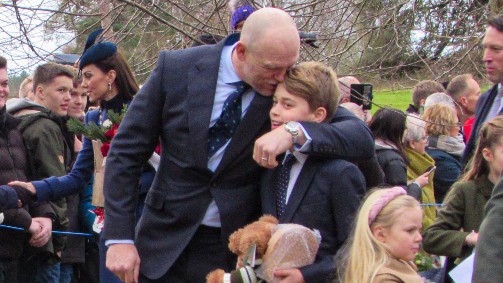 Sharon Moore/Geoff Robinson Photography Picture dated December 25th shows Mike Tindall giving Prince George a hug after the Christmas Day morning church service at St Mary Magdalene Church in Sandringham, Norfolk. A few minutes earlier the Prince was spotted sticking his tongue out at the photographers.
 