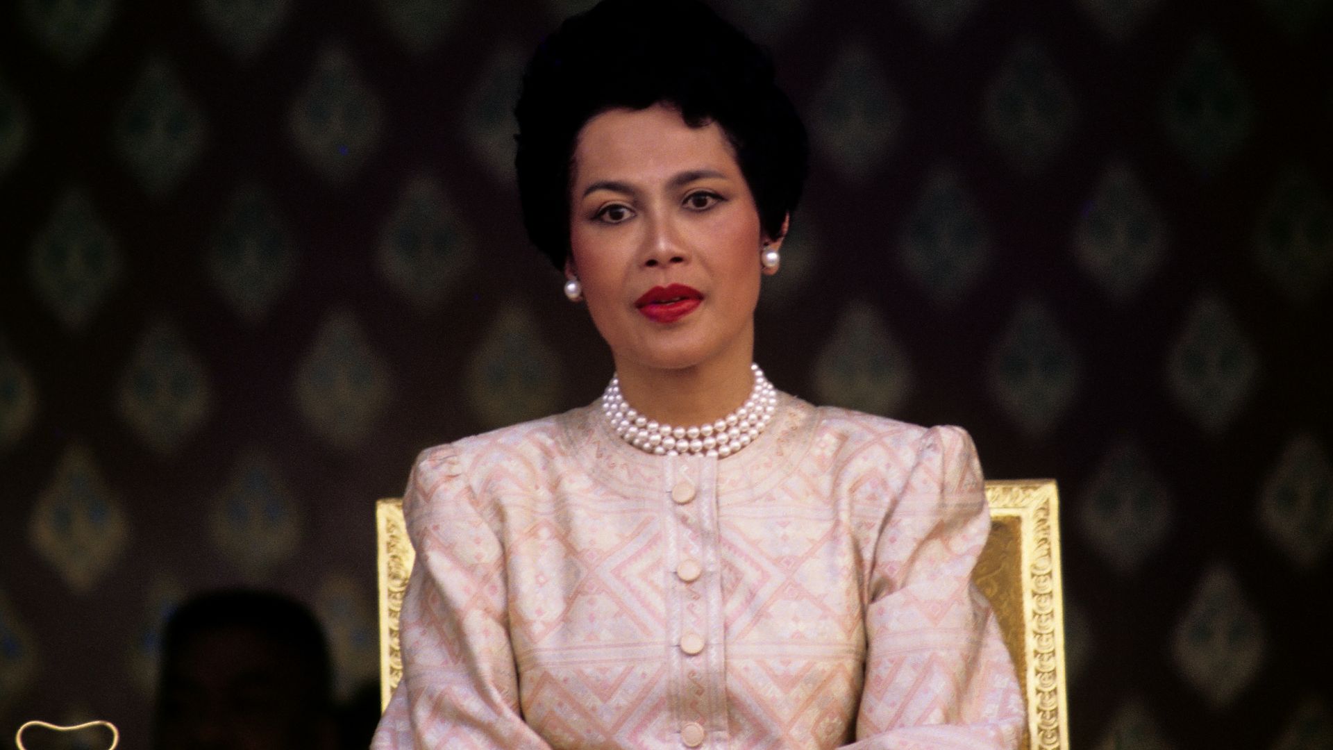 Queen Sirikit seen during the visit to Thailand of Malcolm Forbes at the launch of a 90-foot-tall elephant-shaped balloon in Sanam Luang Park in front of the Grand Palace, Bangkok, Thailand