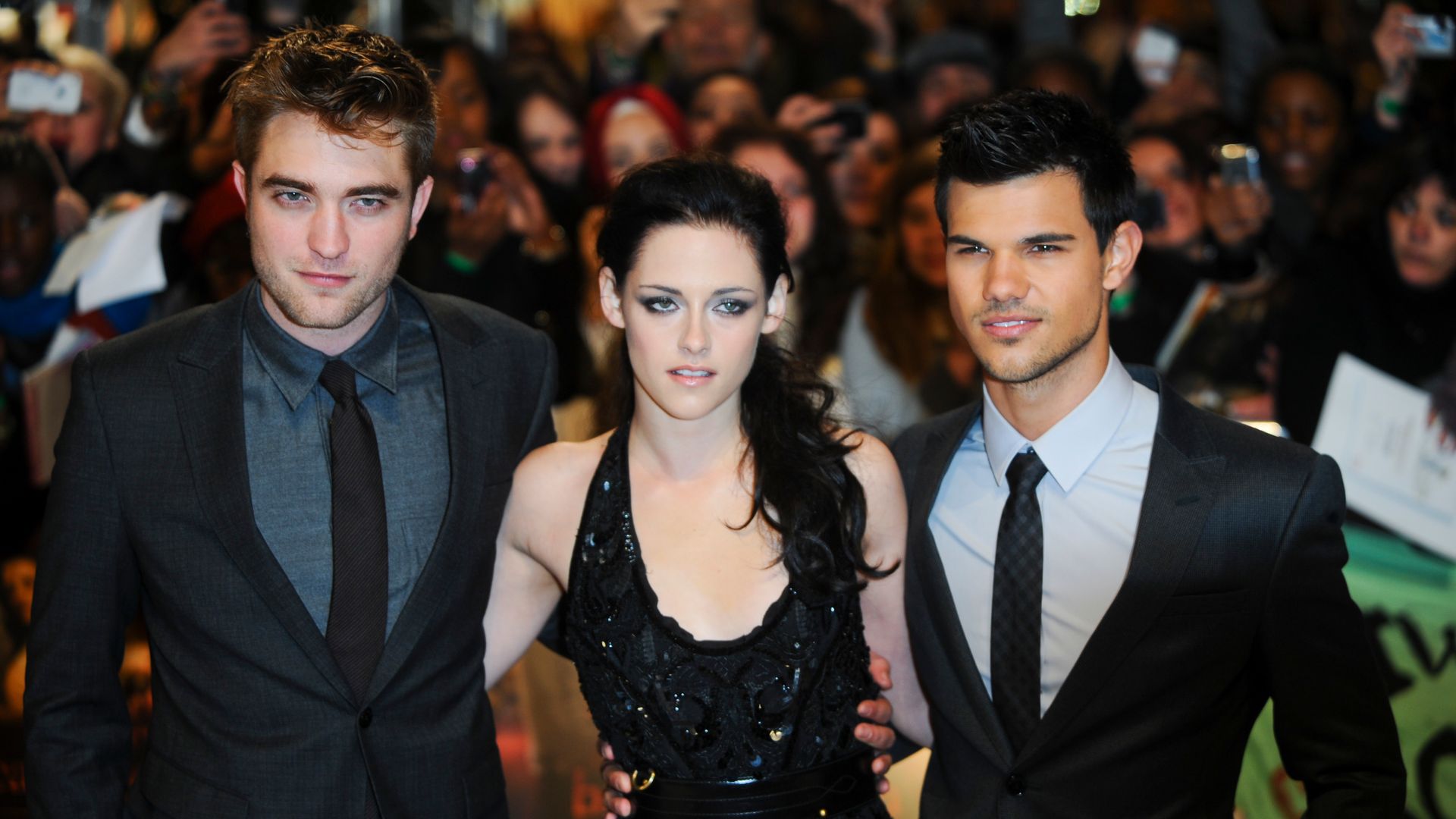 Robert Pattinson, Kristen Stewart and Taylor Lautner attend the UK premiere of The Twilight Saga: Breaking Dawn Part 1 in 2011