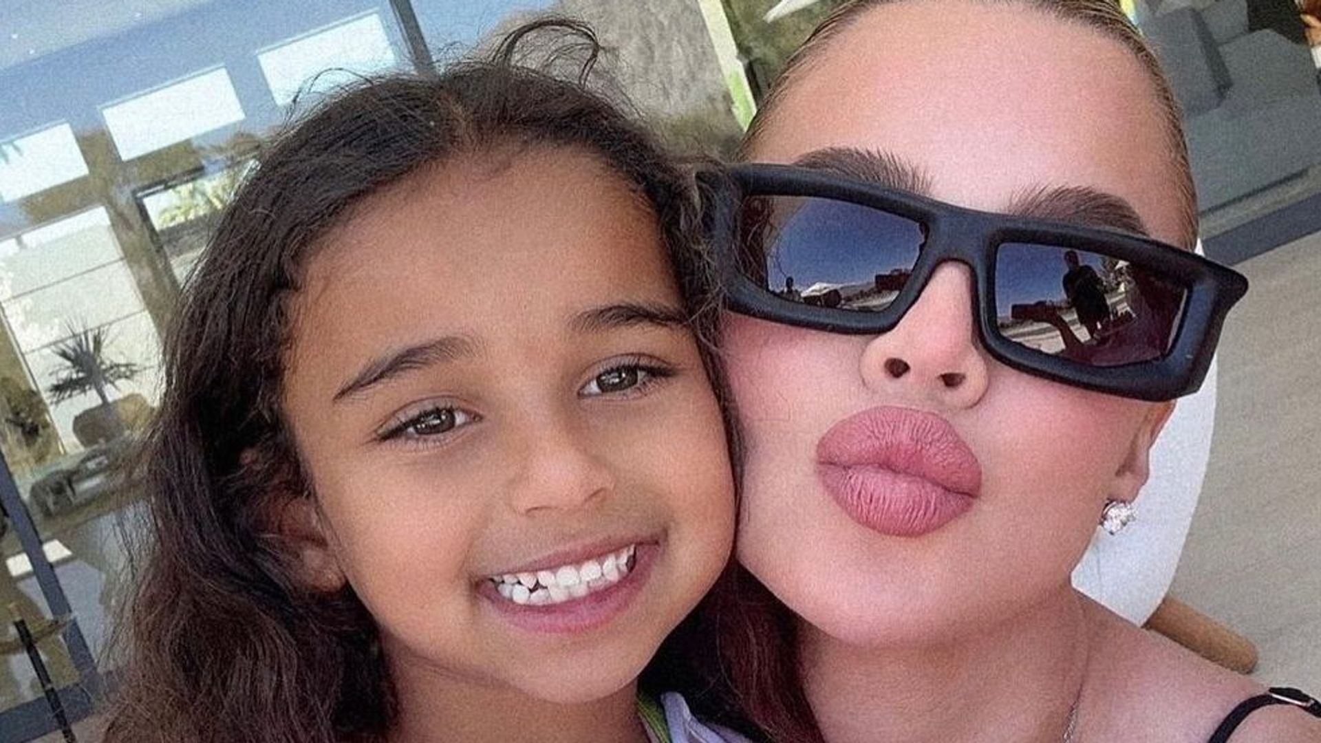 Khloe Kardashian with niece Dream posing for selfie 