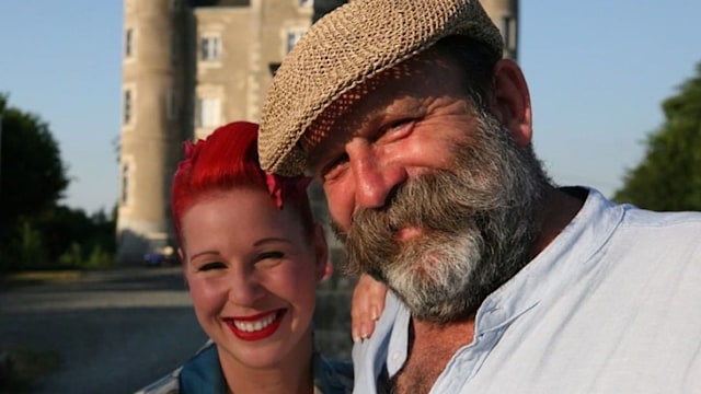 Angel and Dick Strawbridge posing in front of Chateau de la Motte Husson