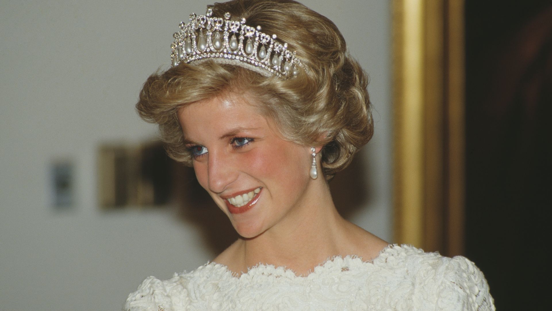 Diana, Princess of Wales in a white lace dress and a tiara
