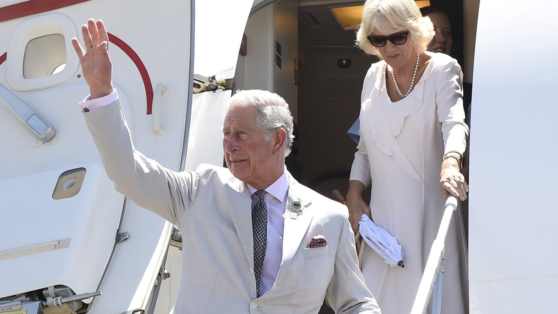 prince charles and camilla leaving airplane