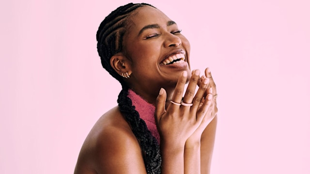 beauty shot of  beautiful black woman in monochromatic pink.. Stock photo, copy space