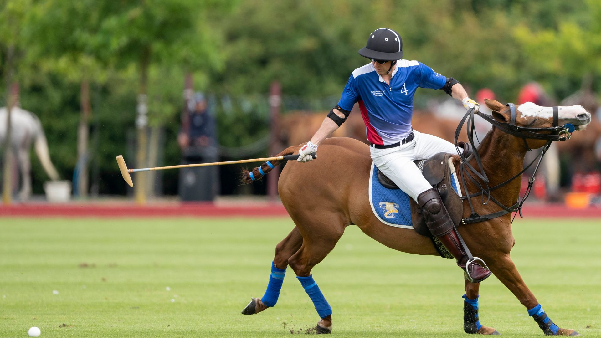 Prince William playing polo