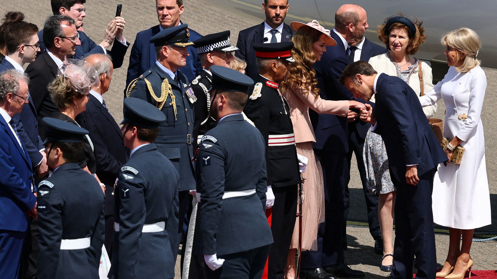 Britain's Prince William, Prince of Wales and Britain's Catherine, Princess of Wales greet France's President Emmanuel Macron and his wife Brigitte Macron, upon arrival at RAF Northolt,