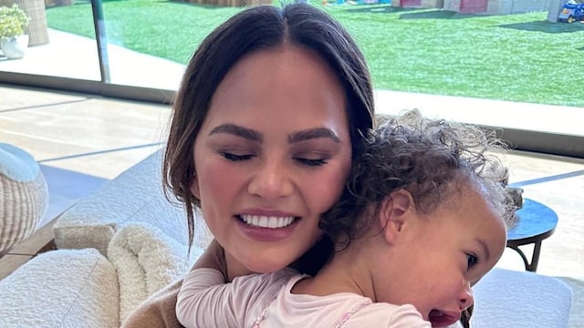 Chrissy Teigen mothering daughter Esti at family home 