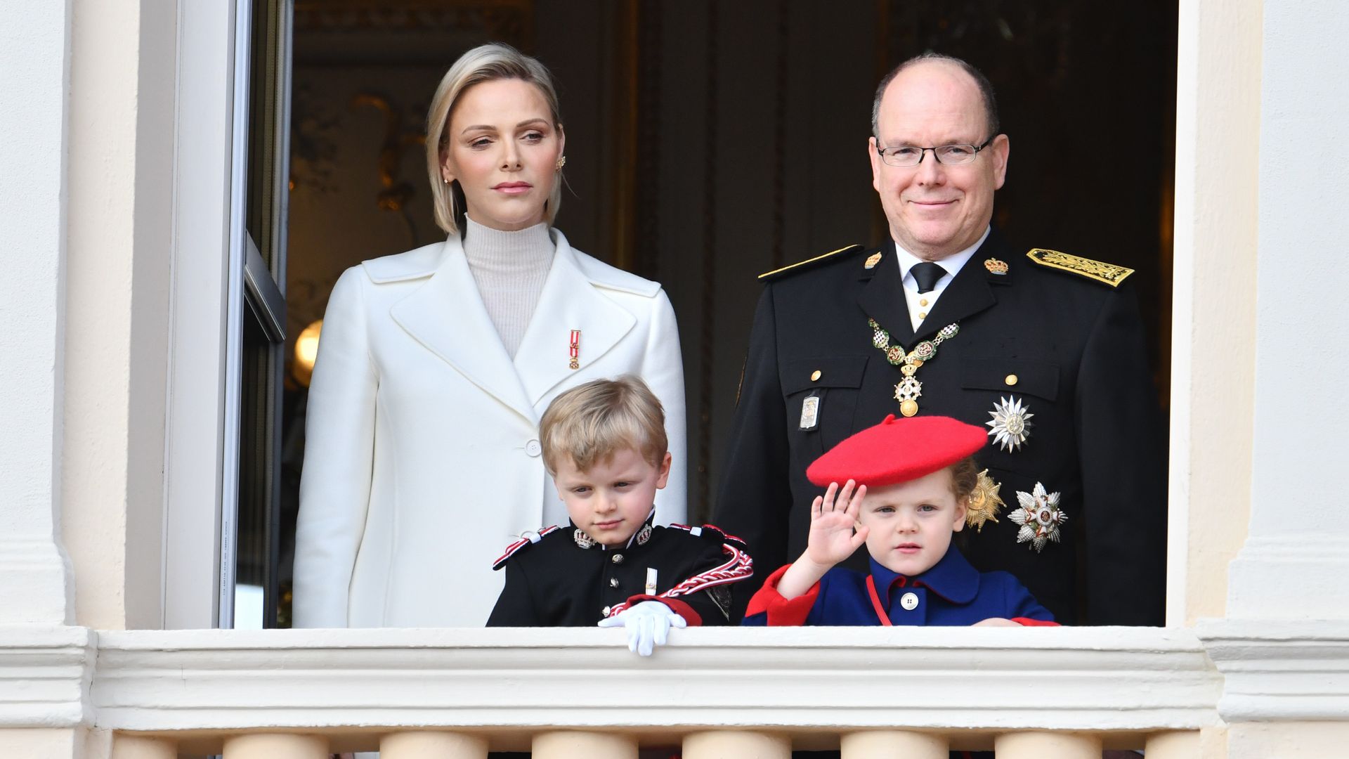 Prince Jacques and Princess Gabriella of Monaco waving on balcony  