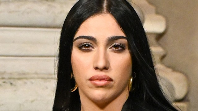lourdes leon covering her breast in black outfit