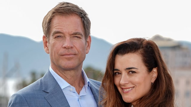 Man and woman posing for photo call