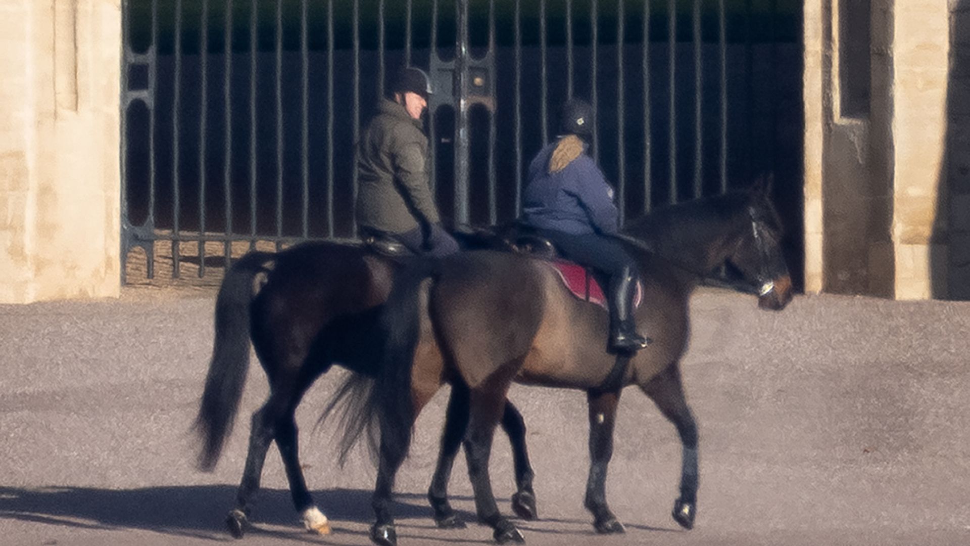 Andrew Mountbatten Windsor is seen out riding with a groom at Windsor Castle today for the first time since losing his royal titles. 