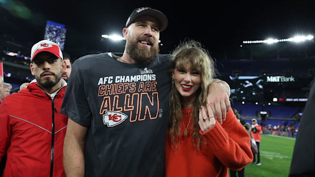 Travis Kelce #87 of the Kansas City Chiefs celebrates with Taylor Swift after a 17-10 victory against the Baltimore Ravens 