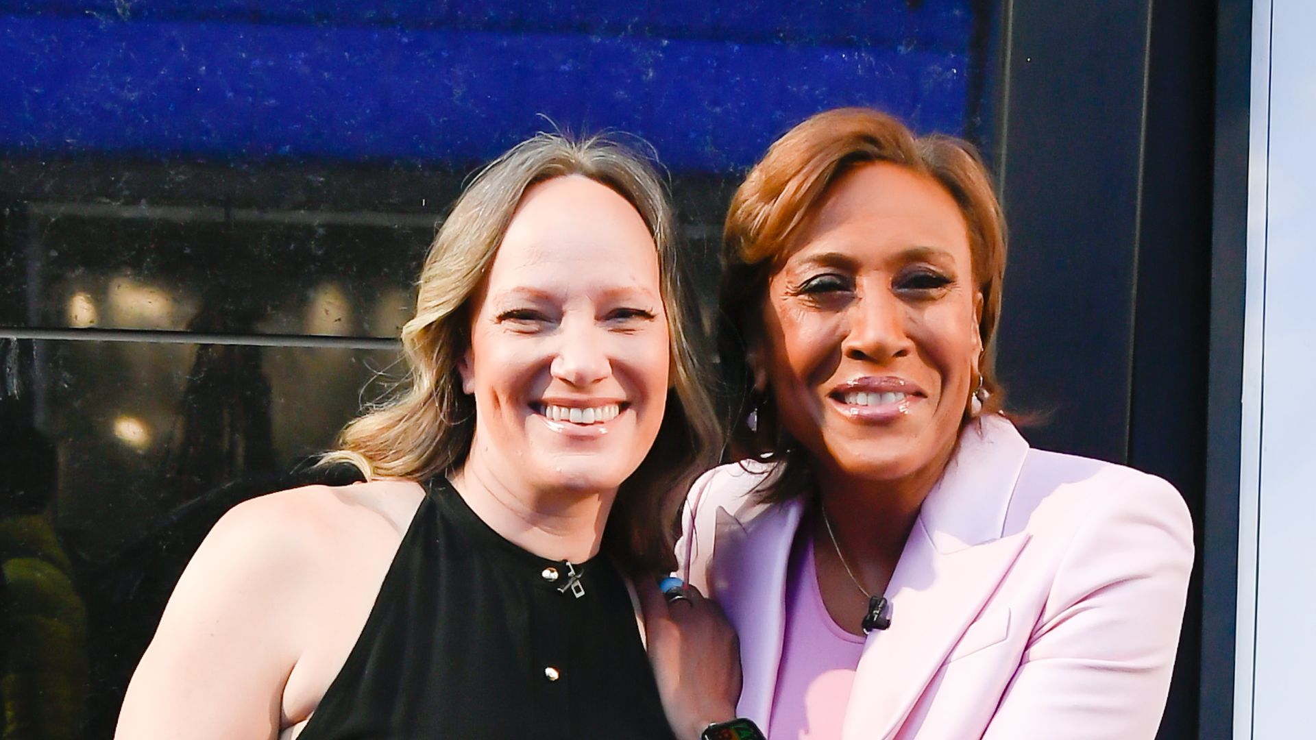 Amber Laign and Robin Roberts celebrate Robin Roberts' 20th "GMA" anniversary outside "Good Morning America" on April 14, 2022 in New York City