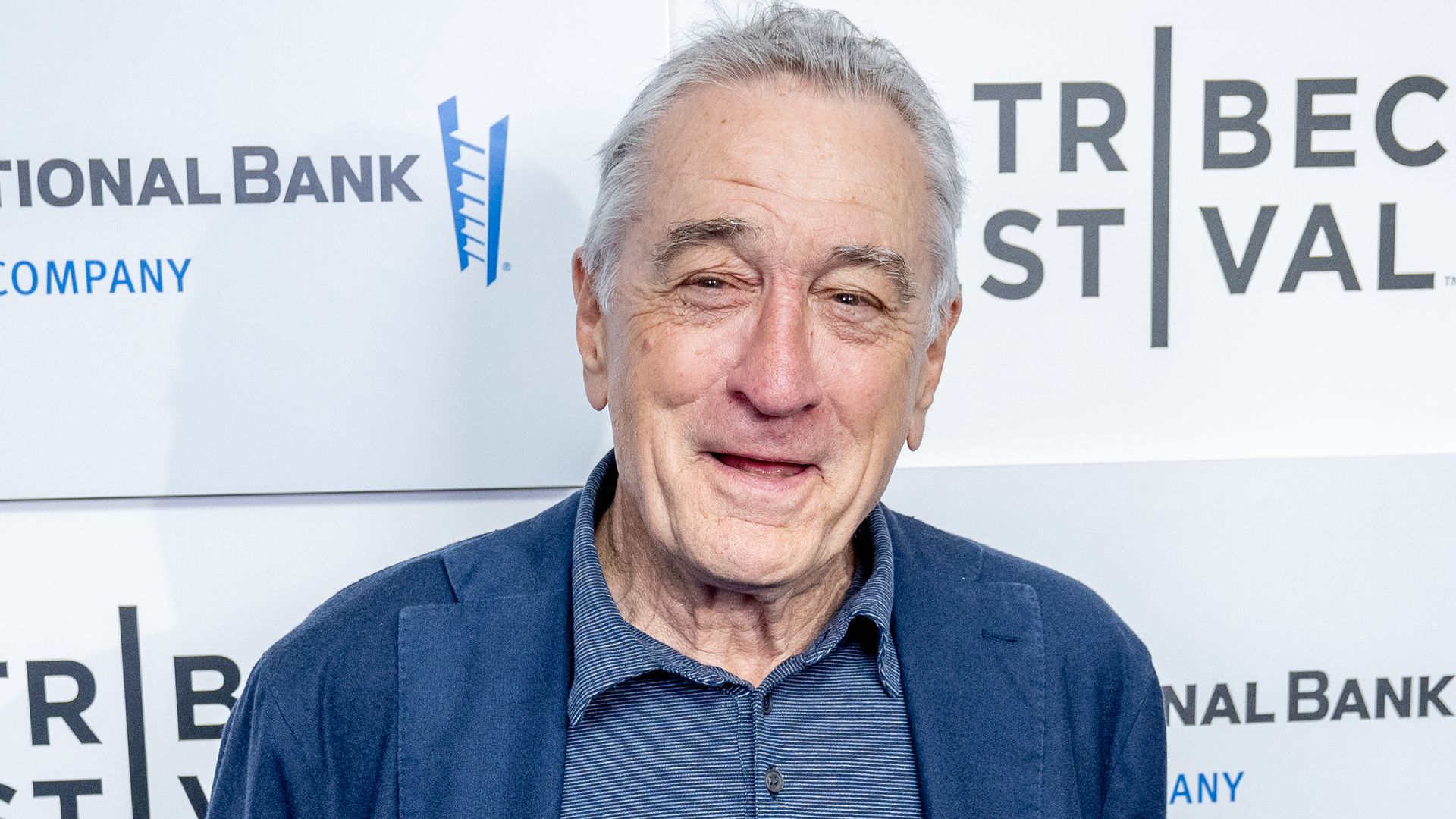 Robert De Niro smiling at a red carpet event