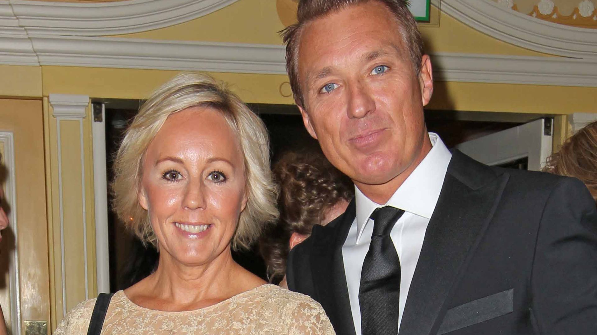 Martin Kemp in a black suit and Shirlie Holliman in a cream and black lace dress