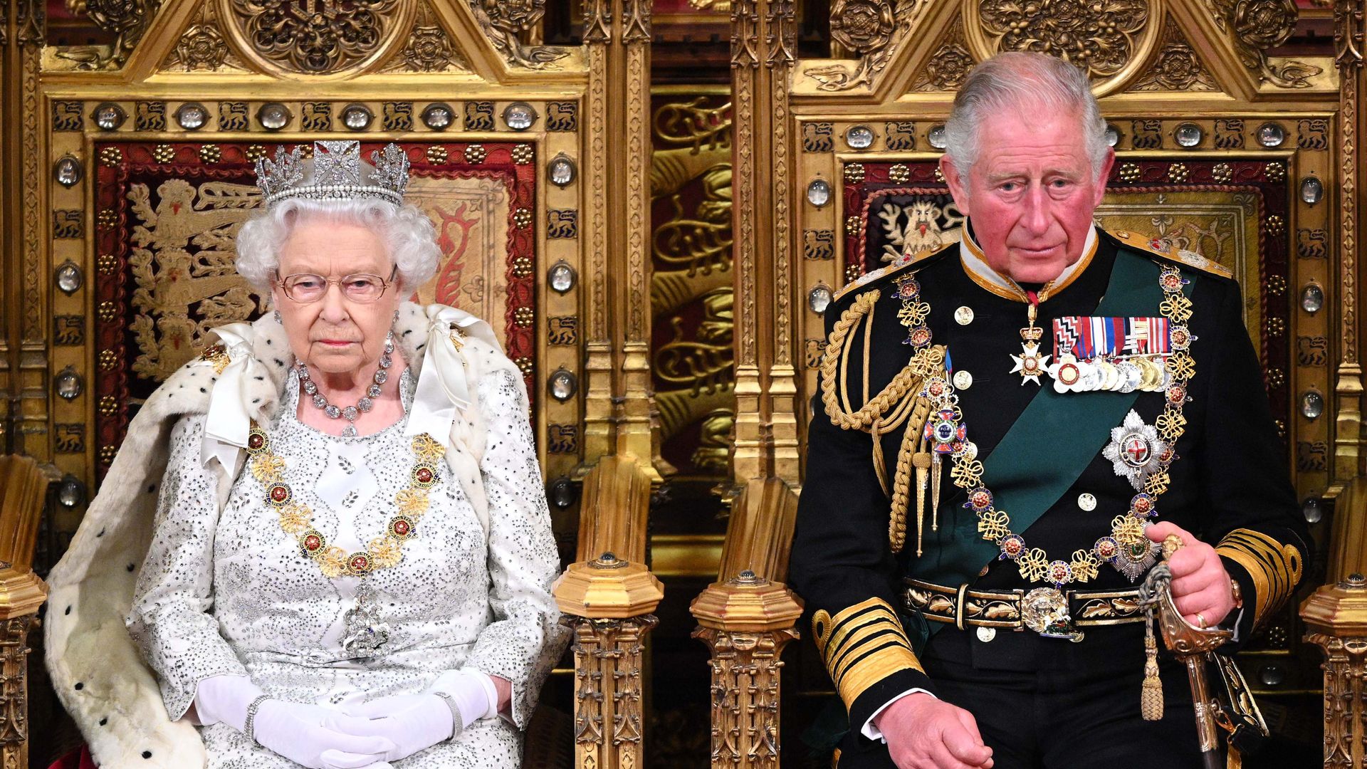 the queen king charles sat on thrones State Opening of Parliament 