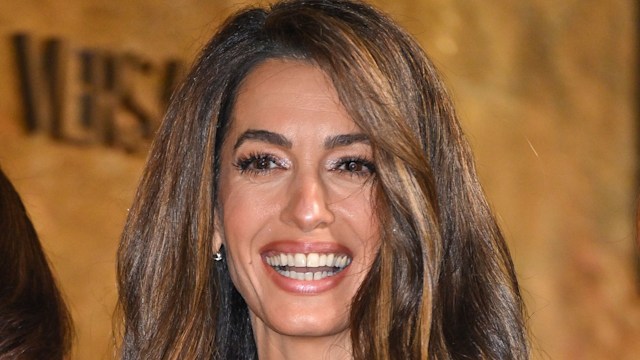 Amal Clooney laughing with nude lipstick on