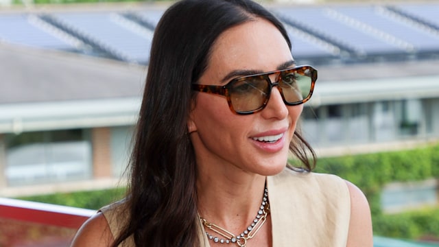 Lauren Silverman in sunglasses and a cream waistcoat