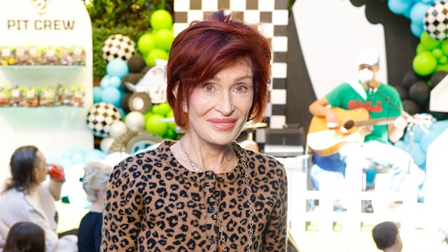sharon osbourne posing in garden
