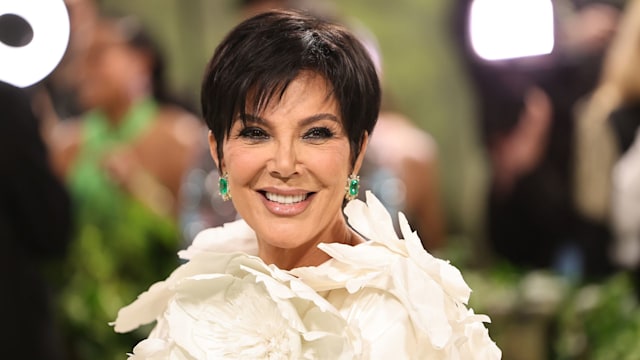 Kris Jenner at the Met Gala in 2024 smiling in white