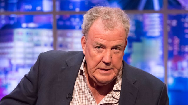 Jeremy Clarkson looking concerned while sitting on a sofa