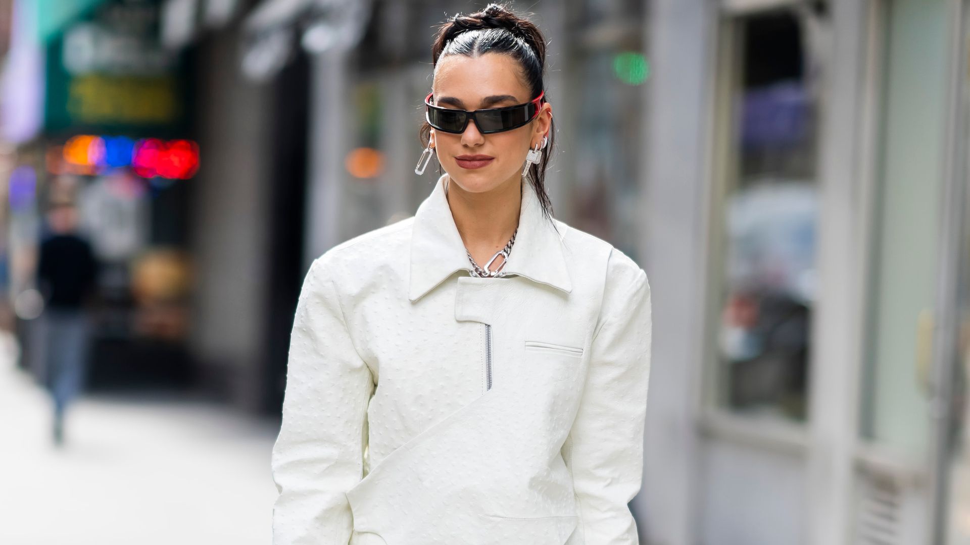 Dua Lipa dazzles in lace-up corset shirt and capri pants 
