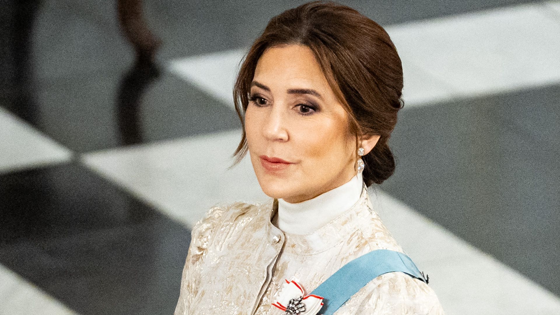 Queen Mary puts on 'show of solidarity' with significant gold brocade dress