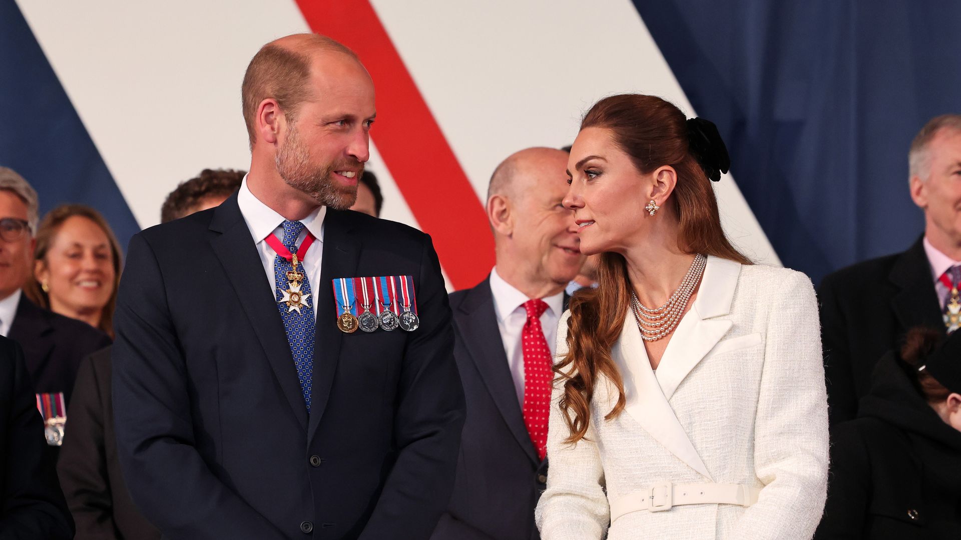Prince William standing with Princess Kate