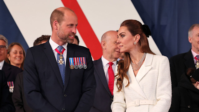Prince William standing with Princess Kate