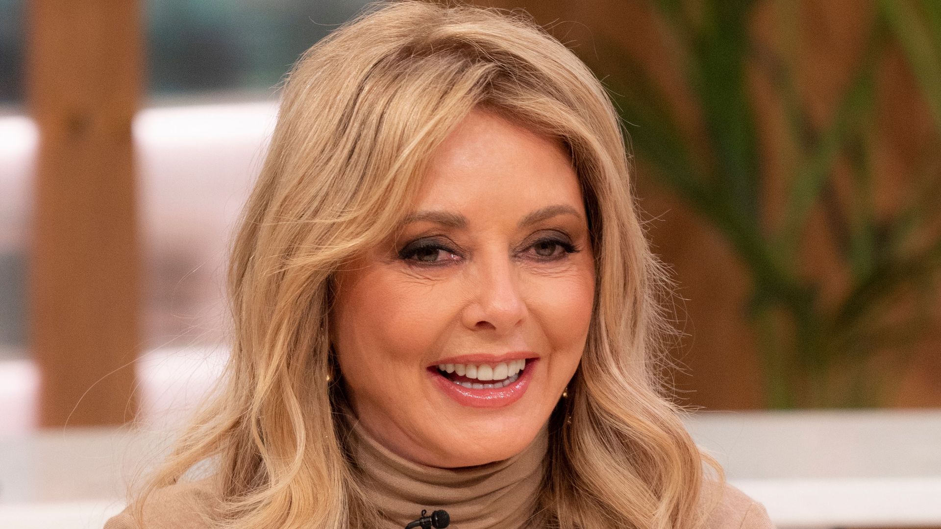 Carol Vorderman is an enchantress in curve-hugging nude ensemble - wow