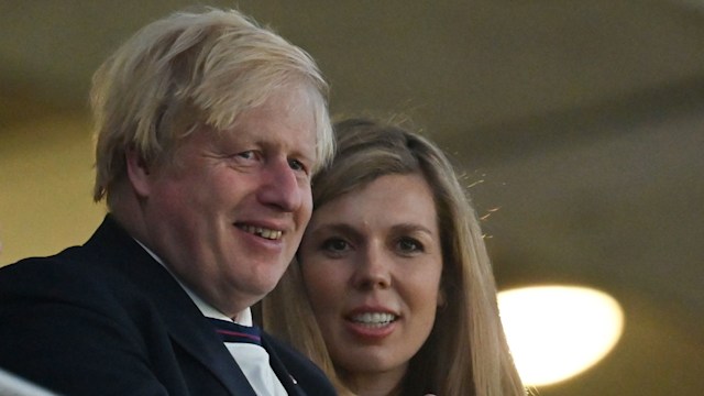 Boris and Carrie Johnson applauding