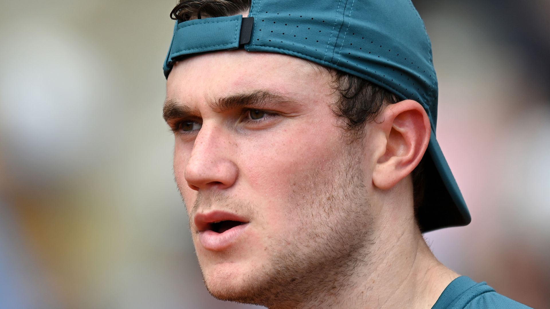 jack draper in green top and cap 