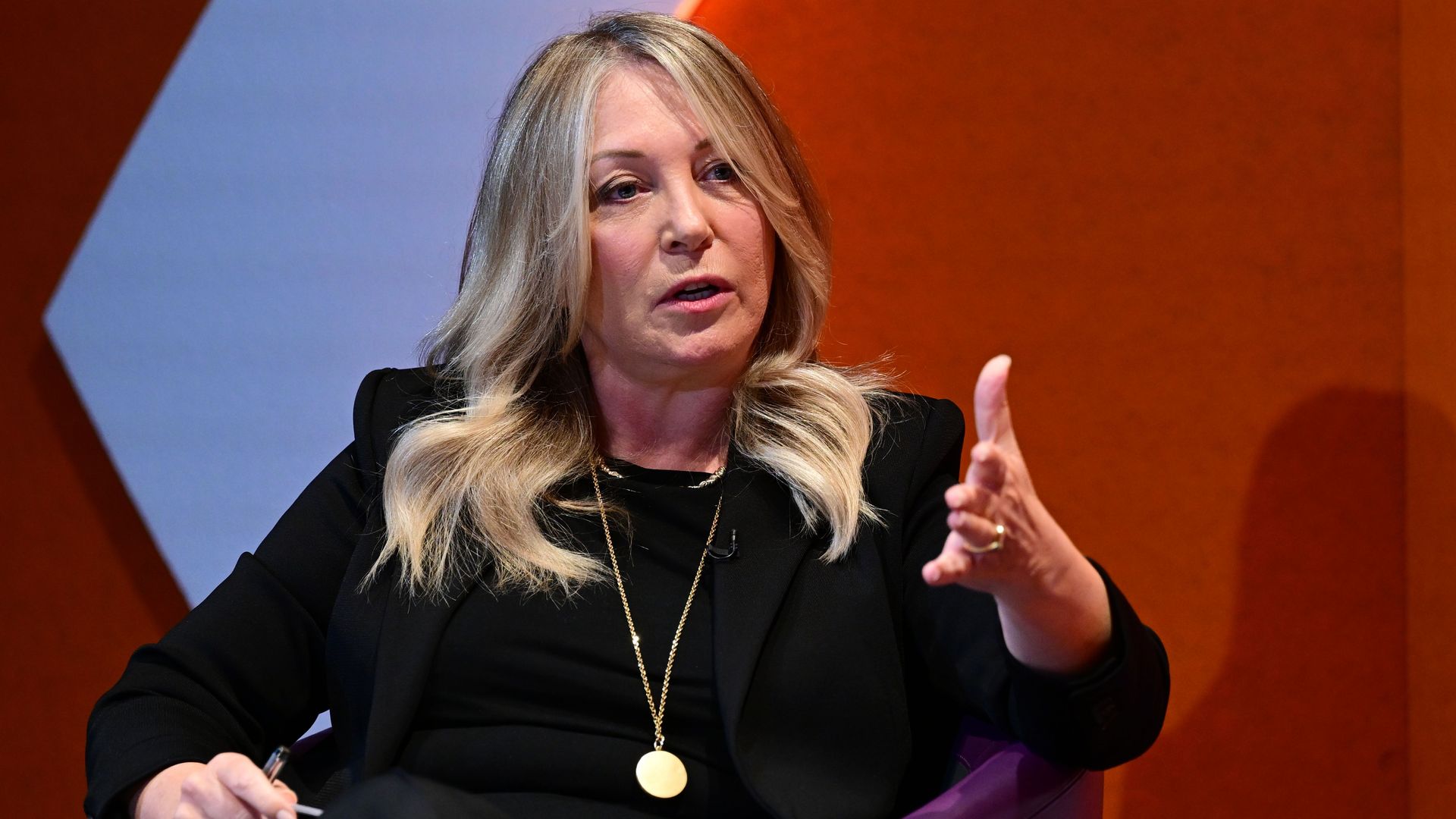 Kirsty Young looking serious in a chair