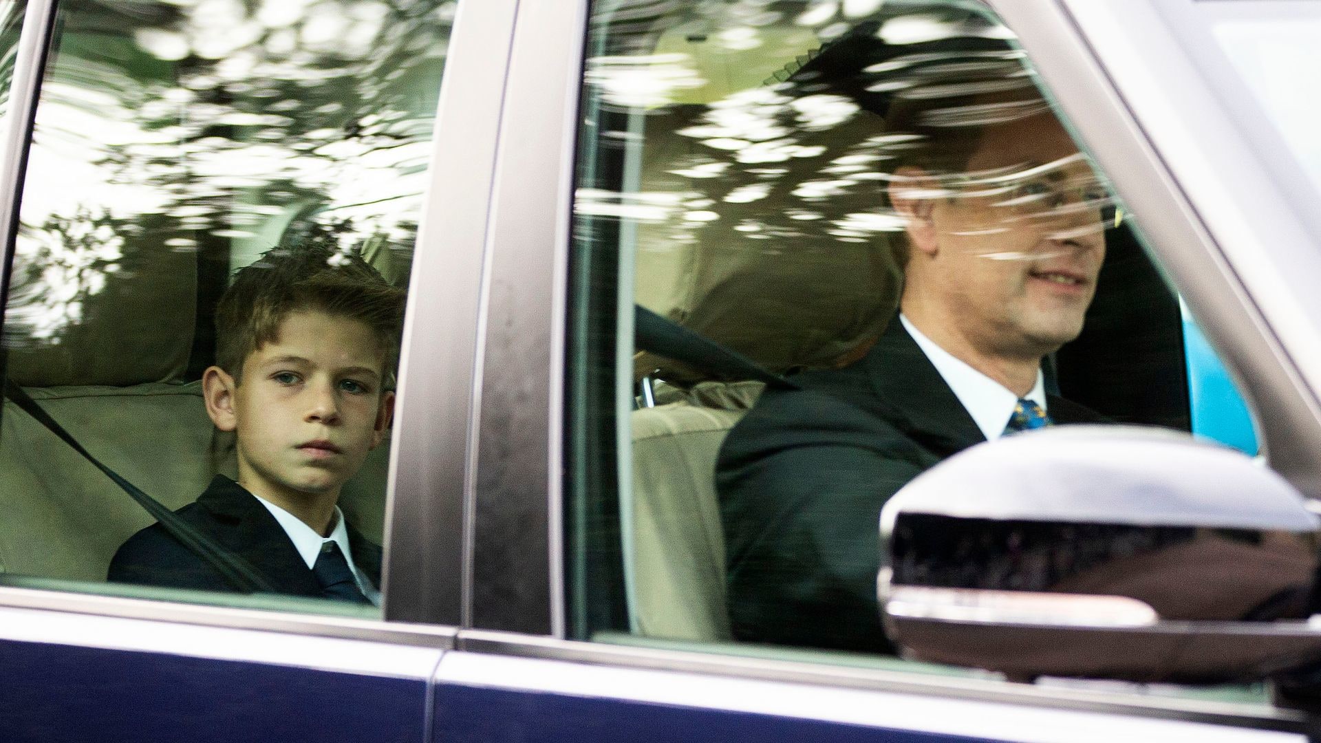 Prince Edward driving with James, Earl of Wessex in the back