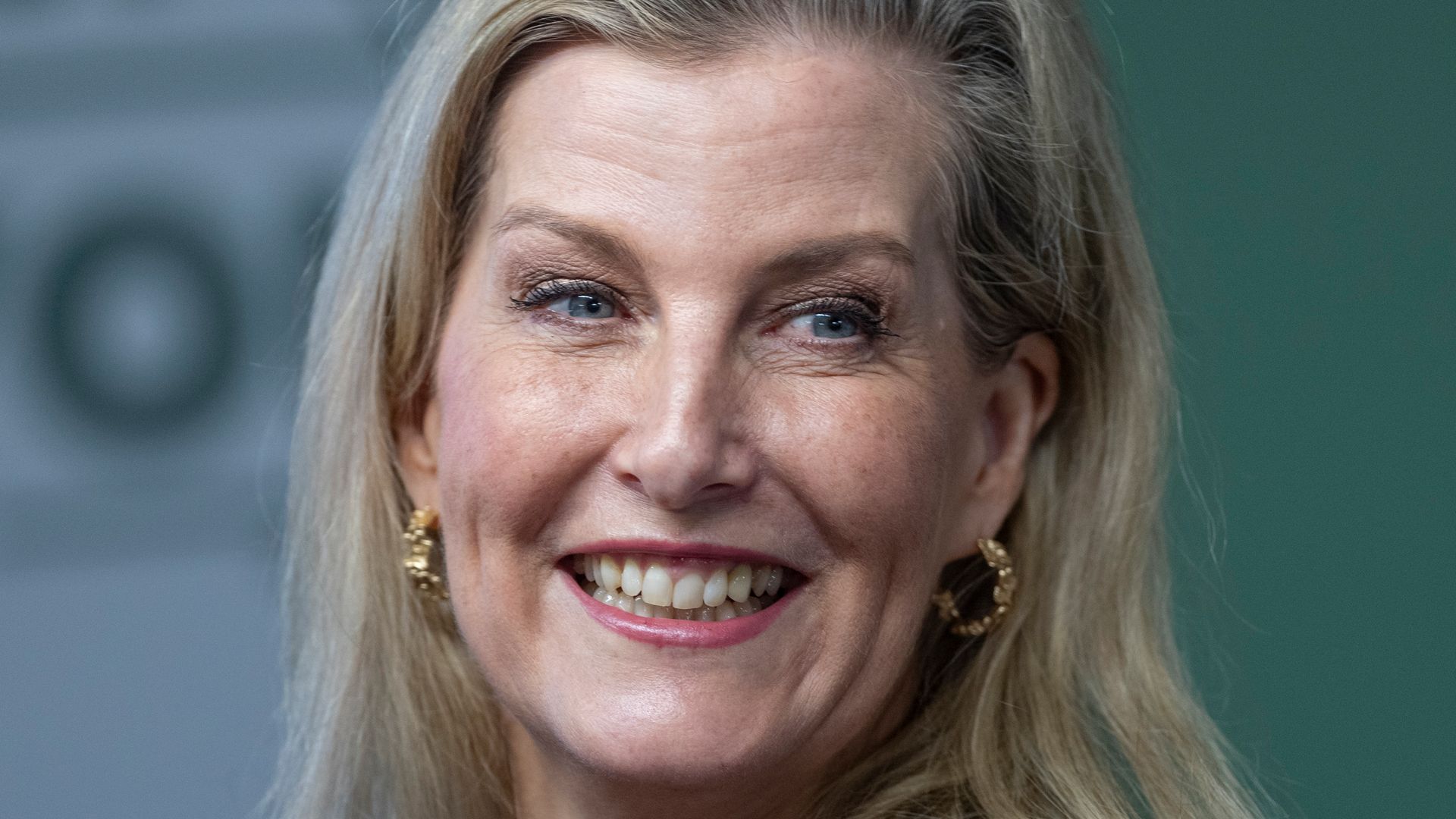 Sophie smiling with hand on chest