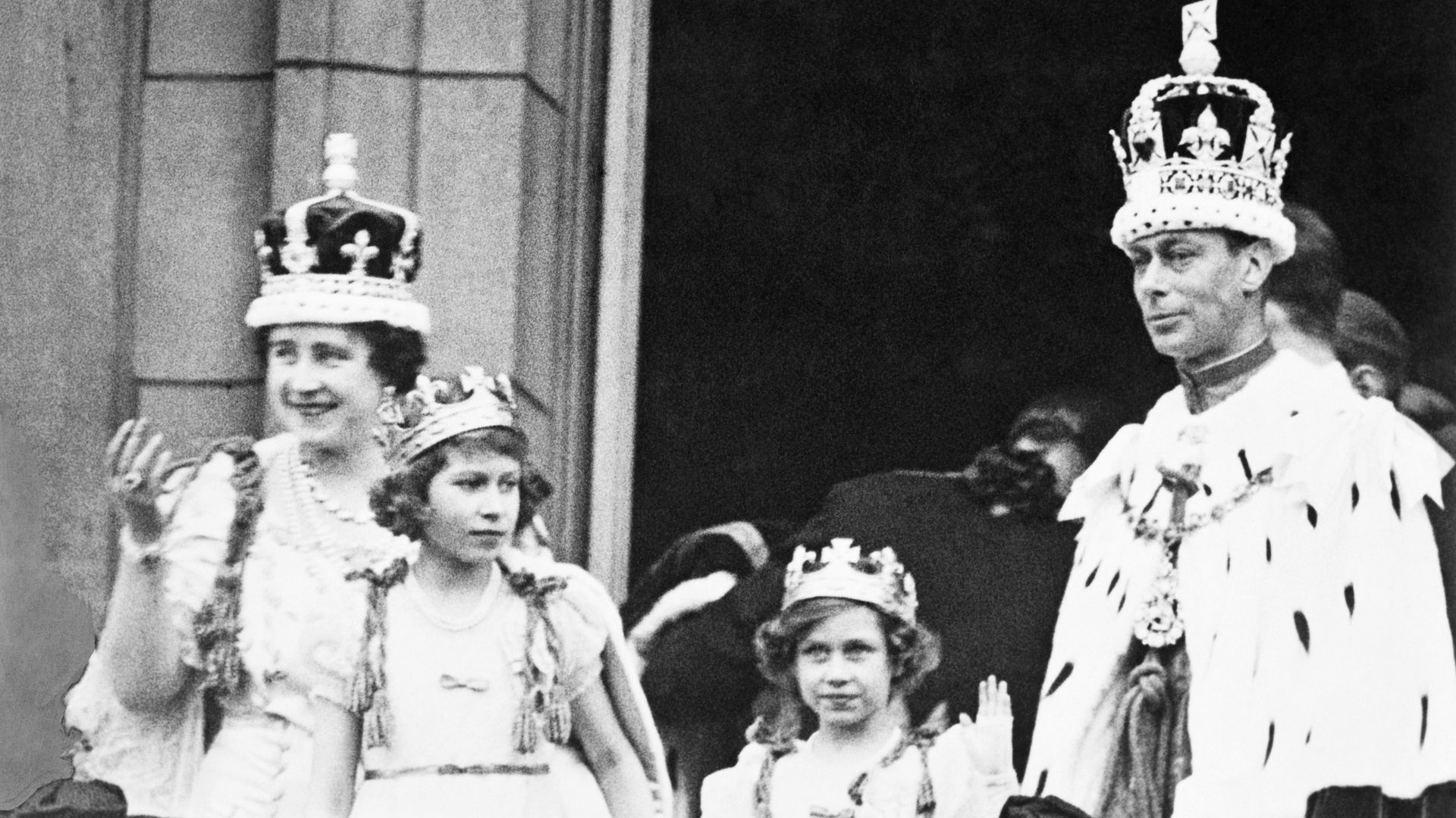 The Queen Mother, a young Queen Elizabeth, a young Princess Margaret and King George VI on Buckingham Palace balcony