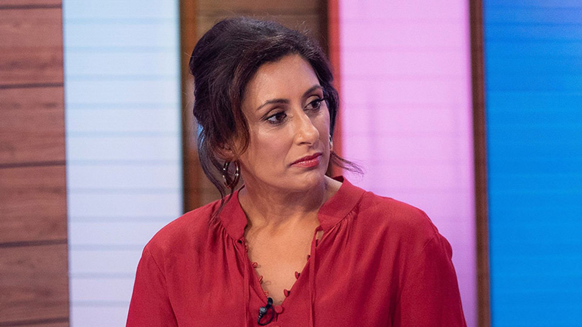 Saira Khan on Loose Women. She is wearing a red blouse. 